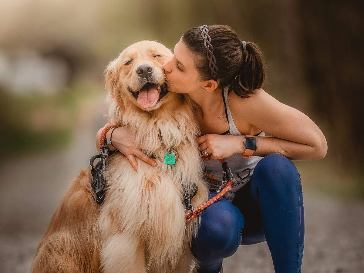 lady cuddling dog